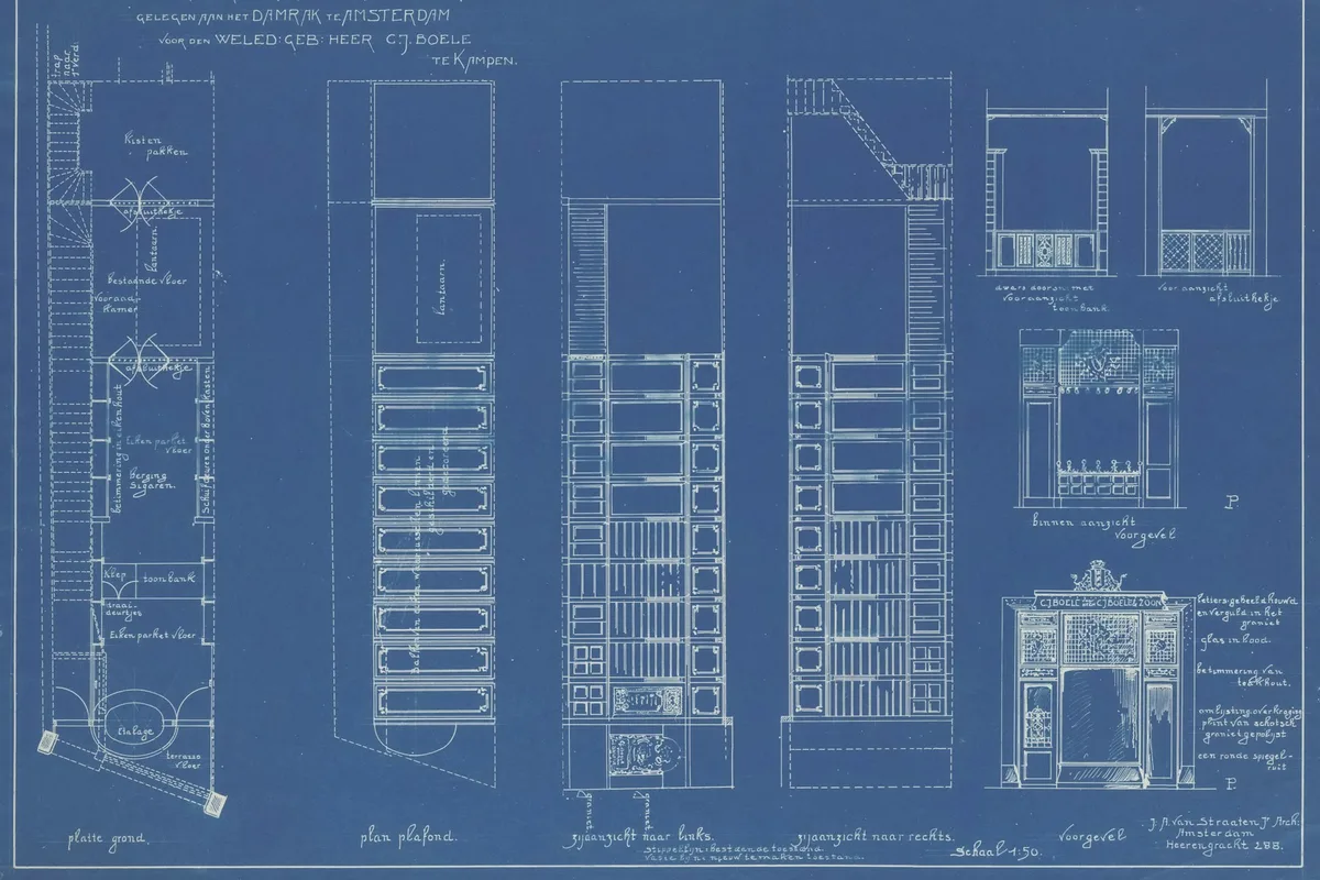 UK architect reviewing building plans and a 3D model in a modern studio