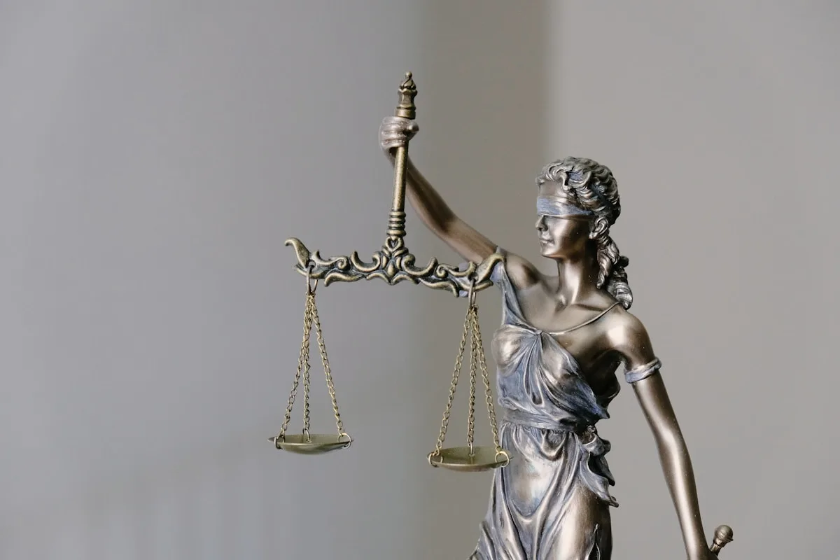 Bronze statue of Lady Justice, blindfolded and holding the scales of justice