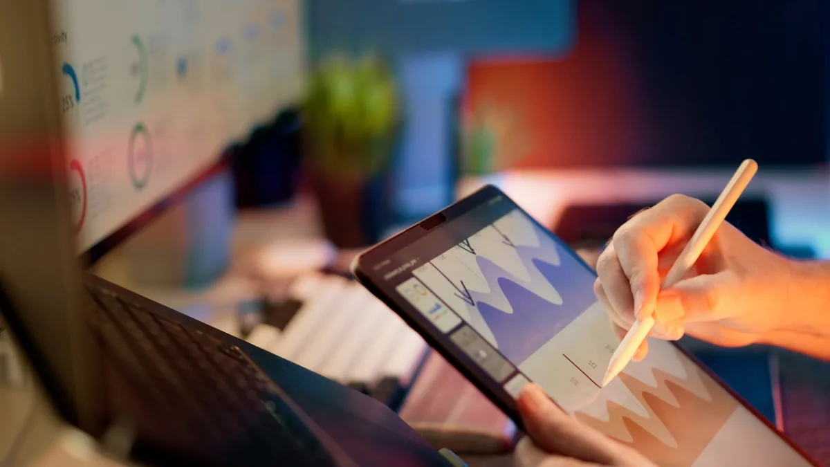 Designer sketching a design on a tablet with a stylus at a creative workspace