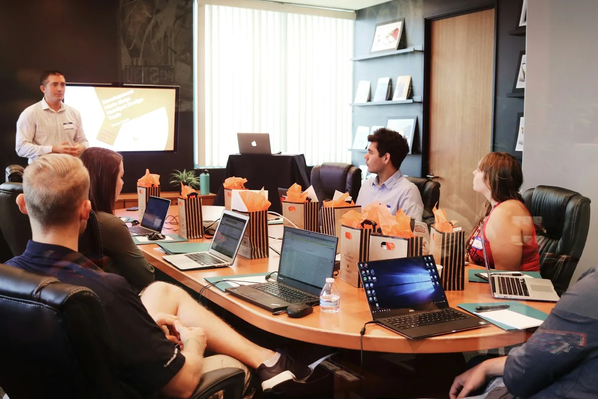 UK management consultants presenting strategy slides in a modern London meeting room