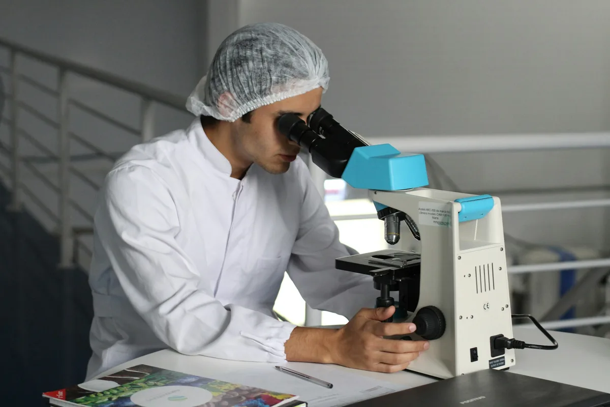 UK research scientist working in a university laboratory with samples and instruments
