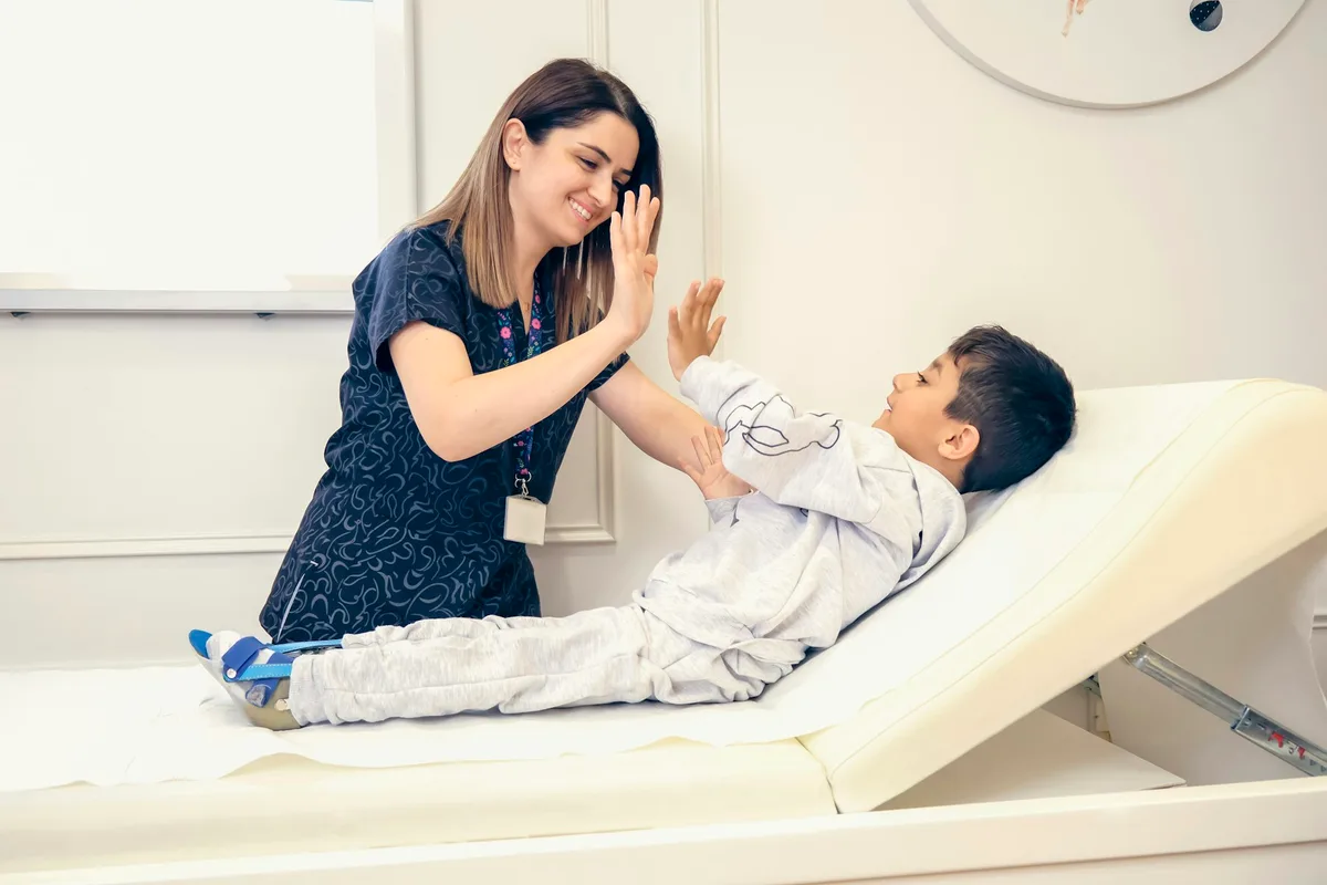 UK speech and language therapist working with a young child on communication skills